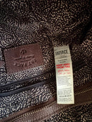 Brown Leather Backpack with Front Zip Pocket and Buckle Closure