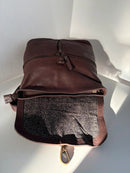 Brown Leather Backpack with Front Zip Pocket and Buckle Closure