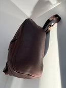 Brown Leather Backpack with Front Zip Pocket and Buckle Closure
