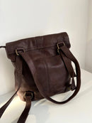 Brown Leather Backpack with Front Zip Pocket and Buckle Closure