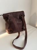 Brown Leather Backpack with Front Zip Pocket and Buckle Closure