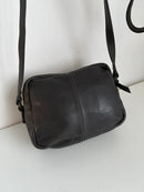 Black Leather Crossbody Bag with Buckle Detail and Patterned Interior