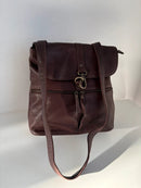 Brown Leather Backpack with Front Zip Pocket and Buckle Closure