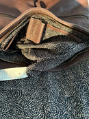 Brown Leather Backpack with Front Zip Pocket and Buckle Closure