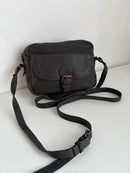 Black Leather Crossbody Bag with Buckle Detail and Patterned Interior